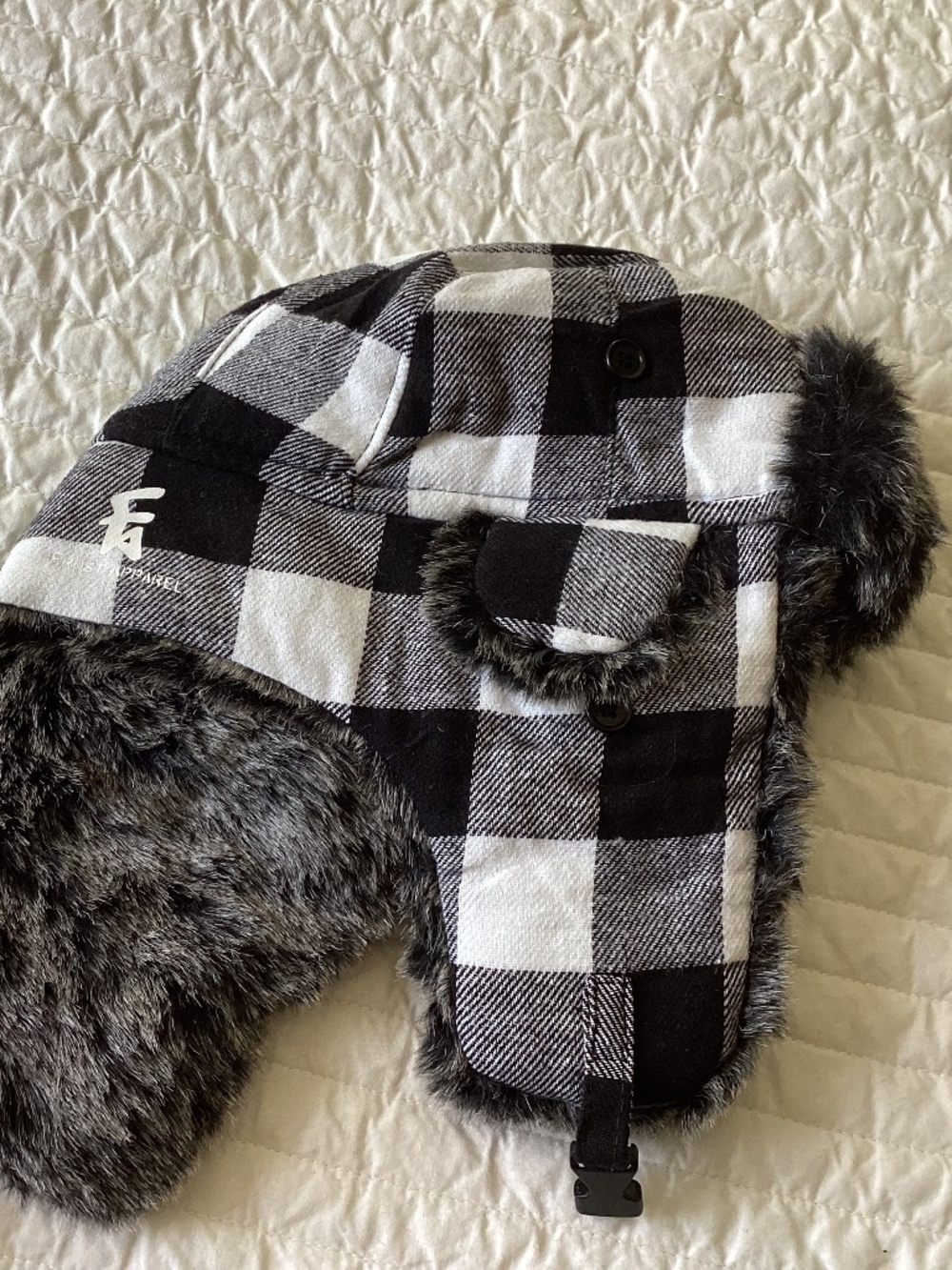 Black and white plaid winter bomber hat. Warm furry winter cap for kids or adult